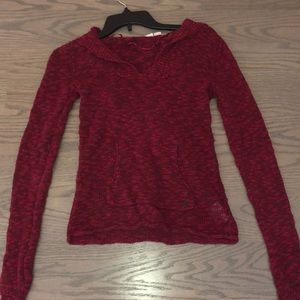 A red sweater/ hoodie.